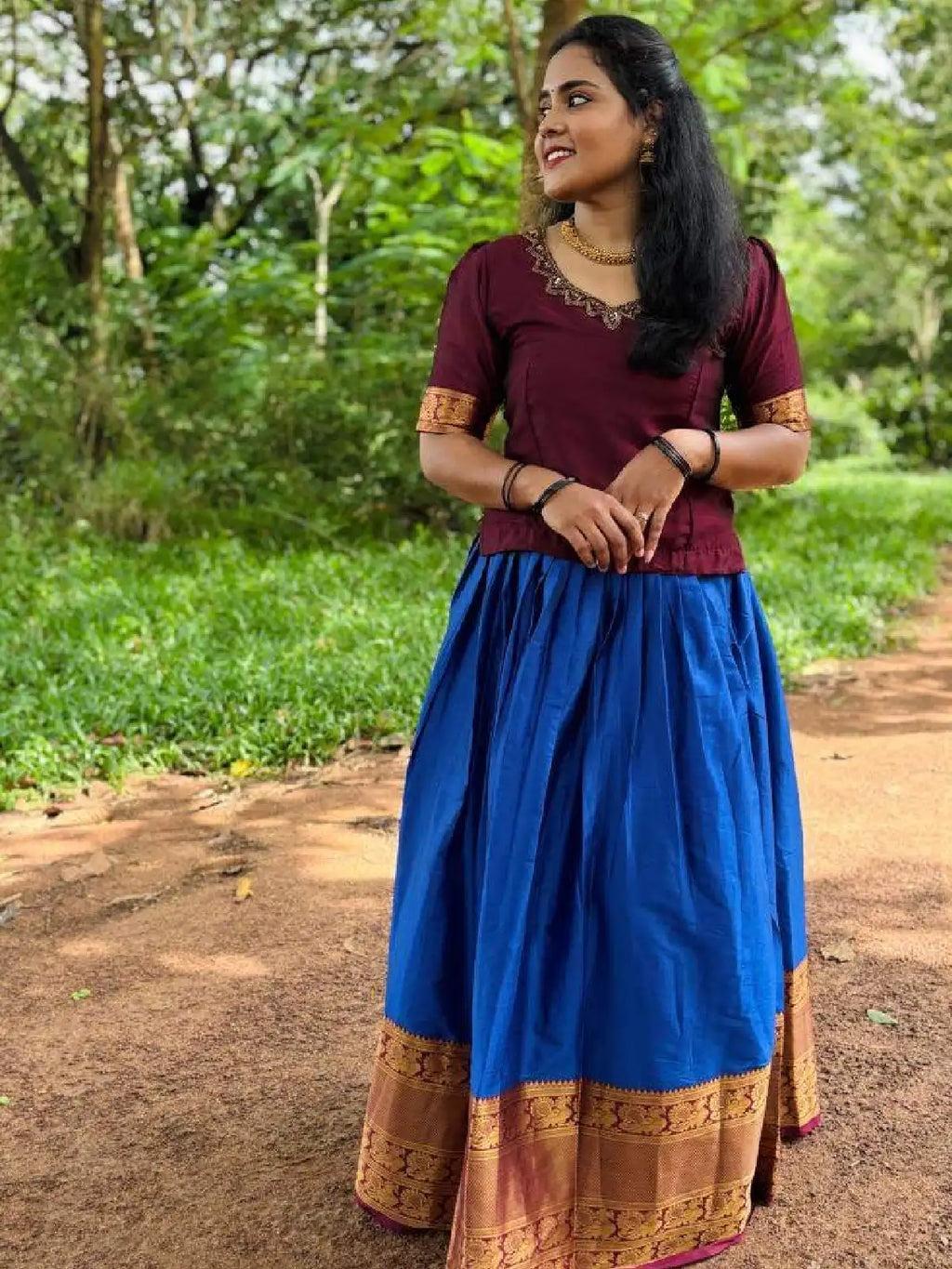 Vichitra silk top with beautiful handwork on neck and narayana patt skirt.