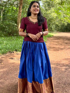 Vichitra silk top with beautiful handwork on neck and narayana patt skirt.