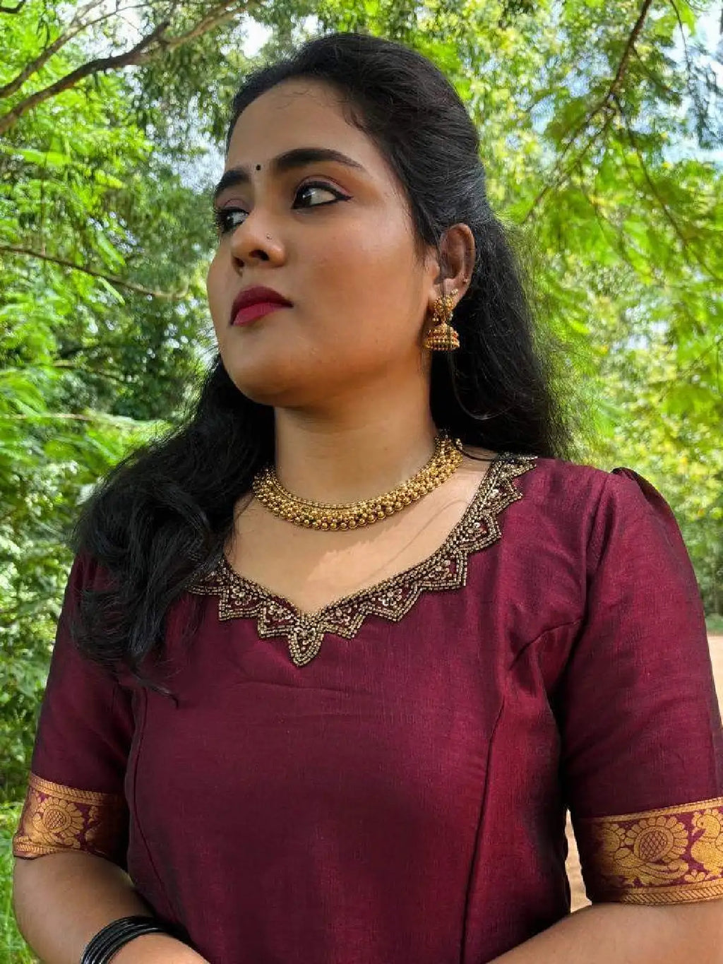 Vichitra silk top with beautiful handwork on neck and narayana patt skirt.