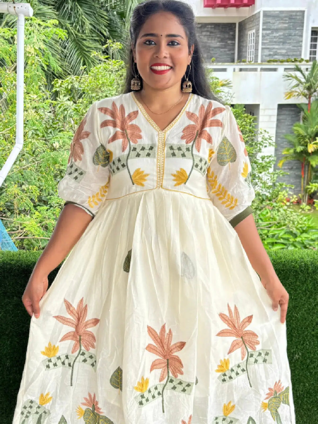 Pure cotton Aliacut kurti highlighted with thread embroidery.
