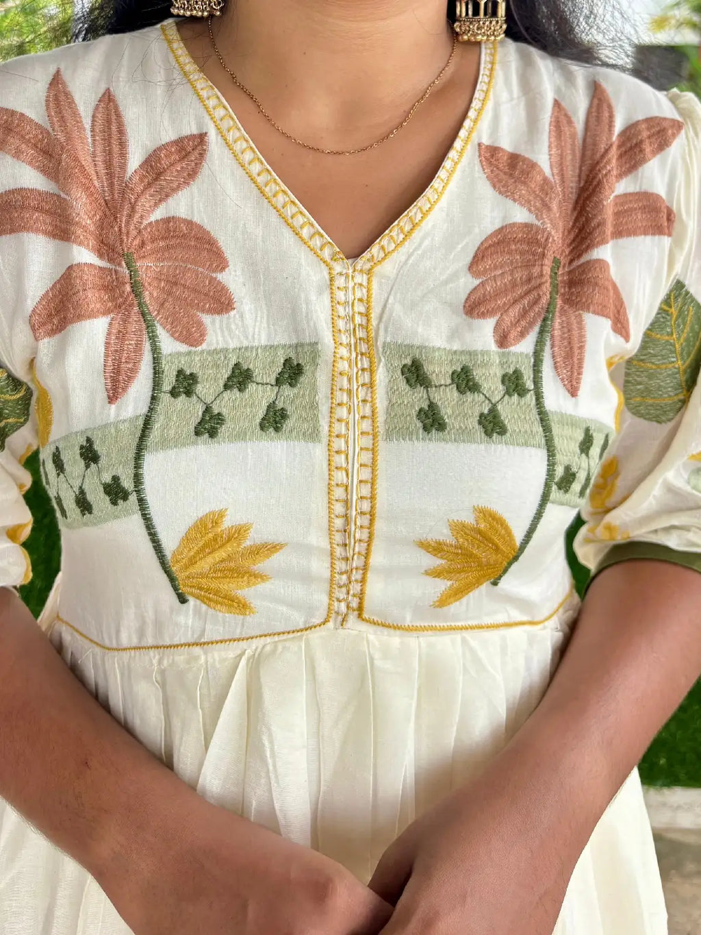 Pure cotton Aliacut kurti highlighted with thread embroidery.